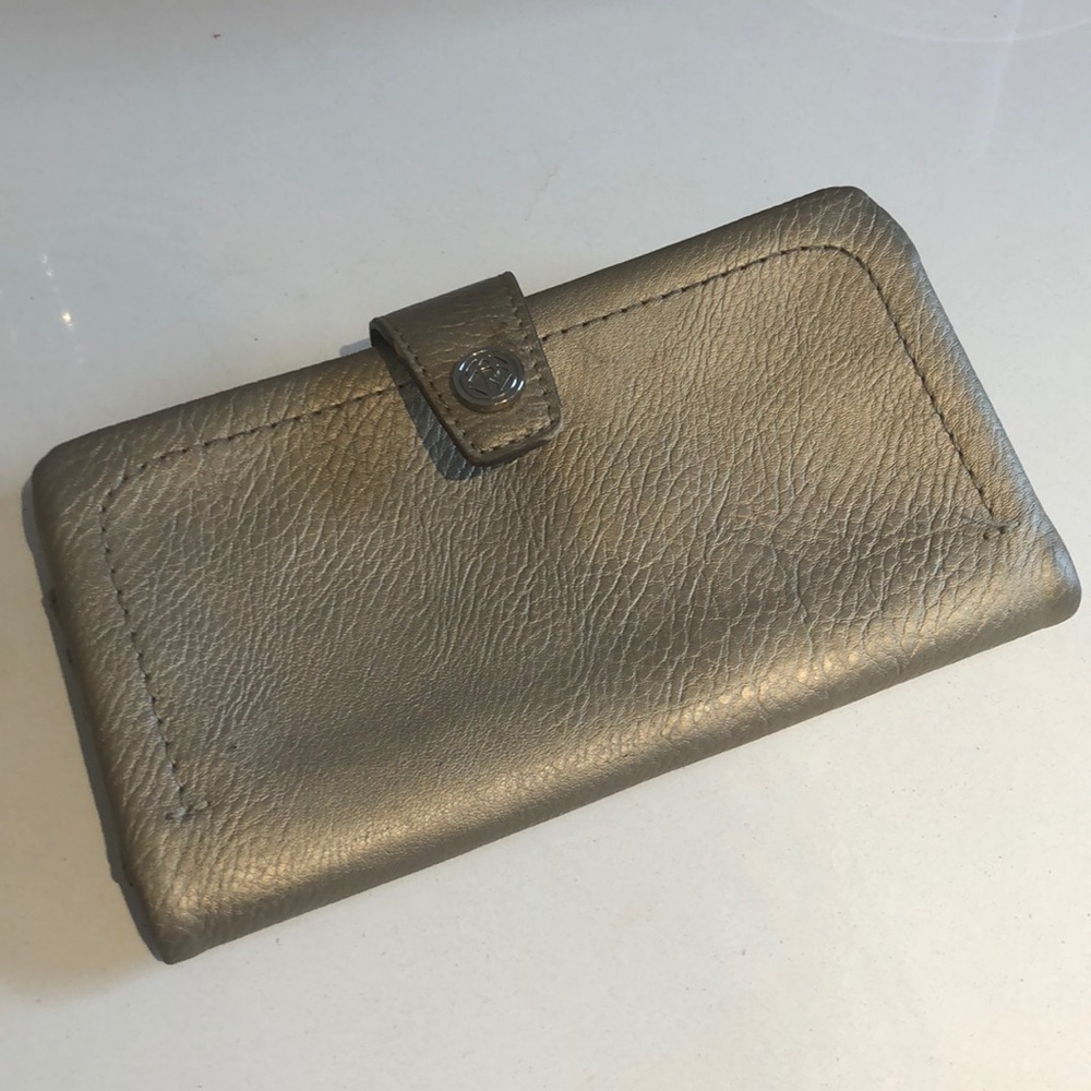 Gold wallet/ relic by Fossil